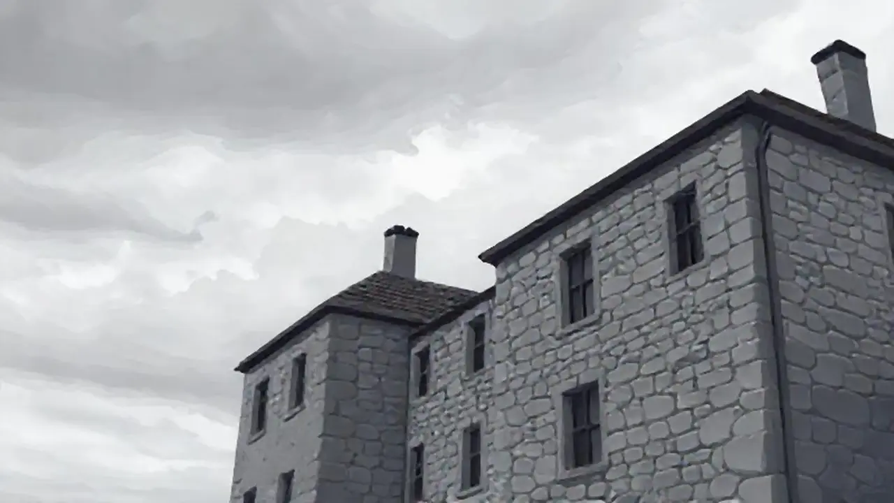 Edificio gris bajo un cielo nublado
