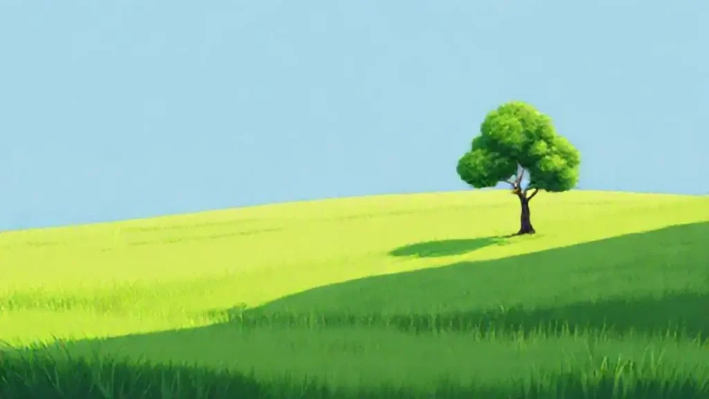 Prado verde y un árbol