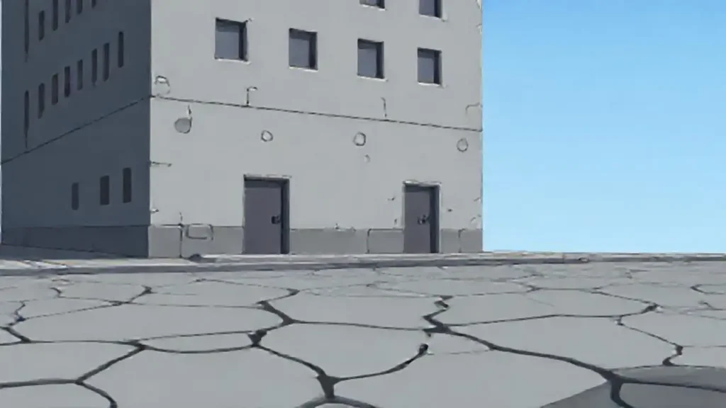Edificio gris sobre pavimento agrietado
