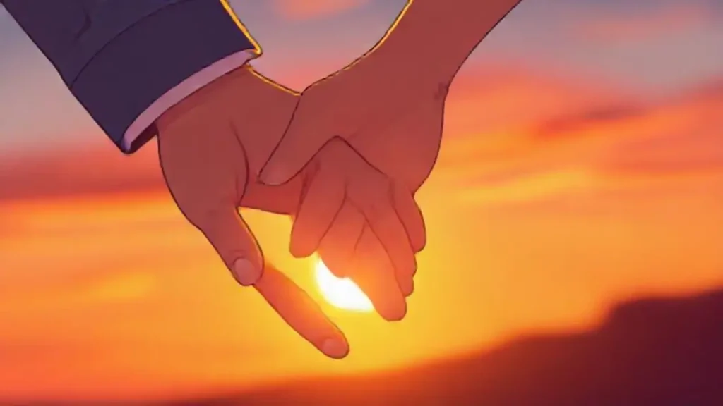 Manos entrelazadas al atardecer