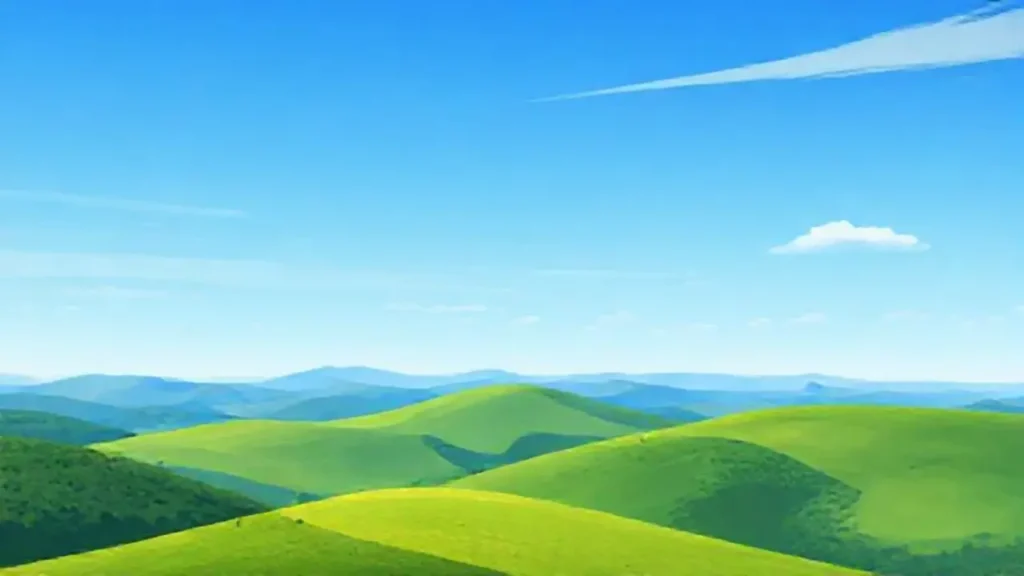 Cielo azul sobre colinas verdes