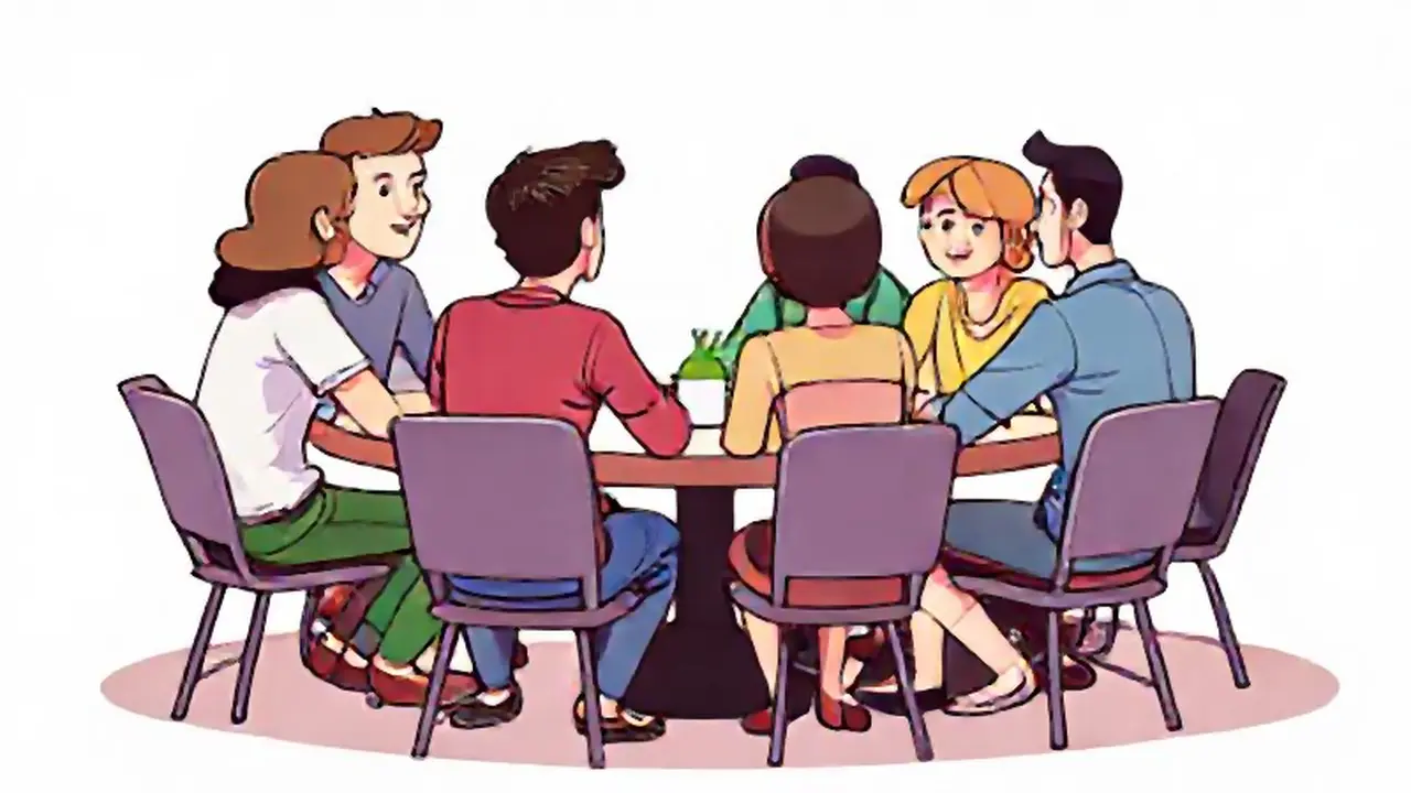 Personas reunidas a la mesa