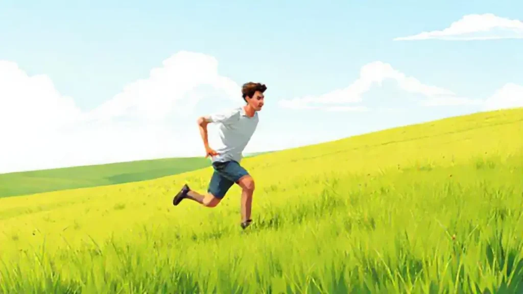 Un hombre corre por un prado verde
