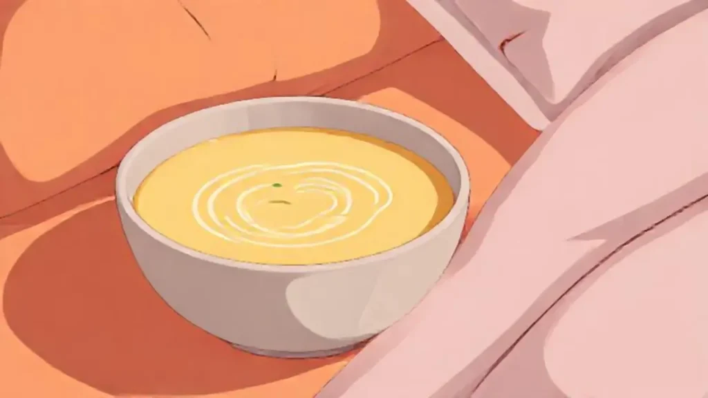 Sopa cremosa junto a la cama