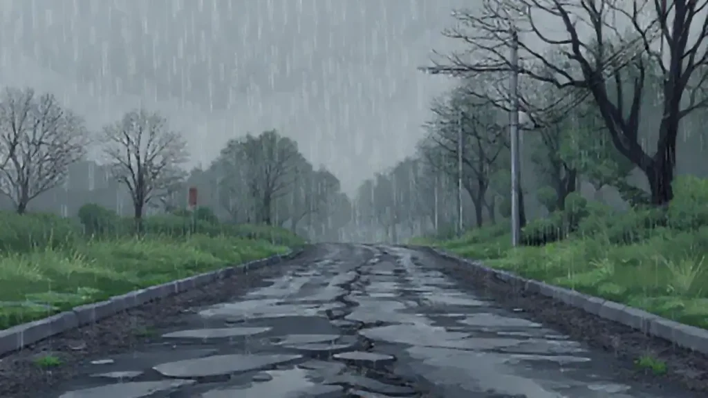 Lluvia gris sobre la carretera rota