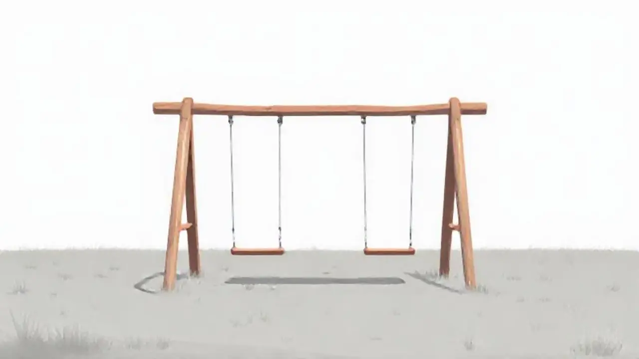 Columpio vacío en campo gris