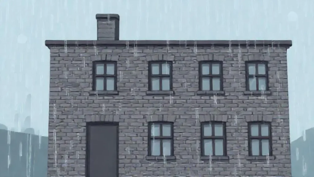 Lluvia sobre un edificio gris de ladrillo