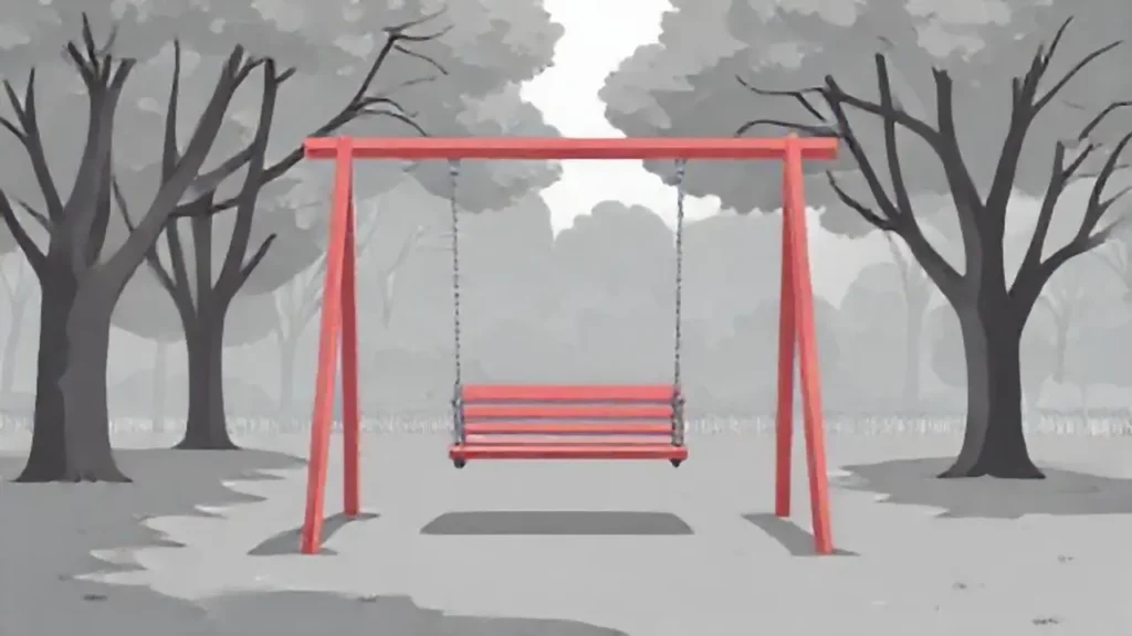 Columpio vacío en el parque gris